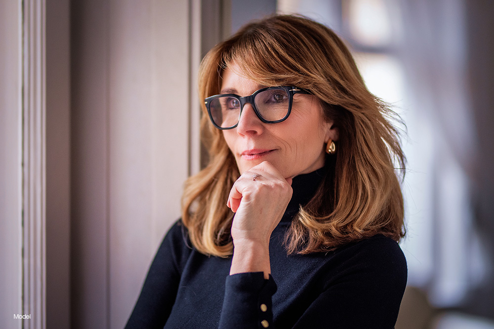 Mature woman in black glasses