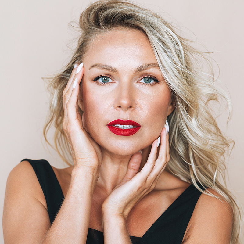 Woman with blonde hair and red lipstick
