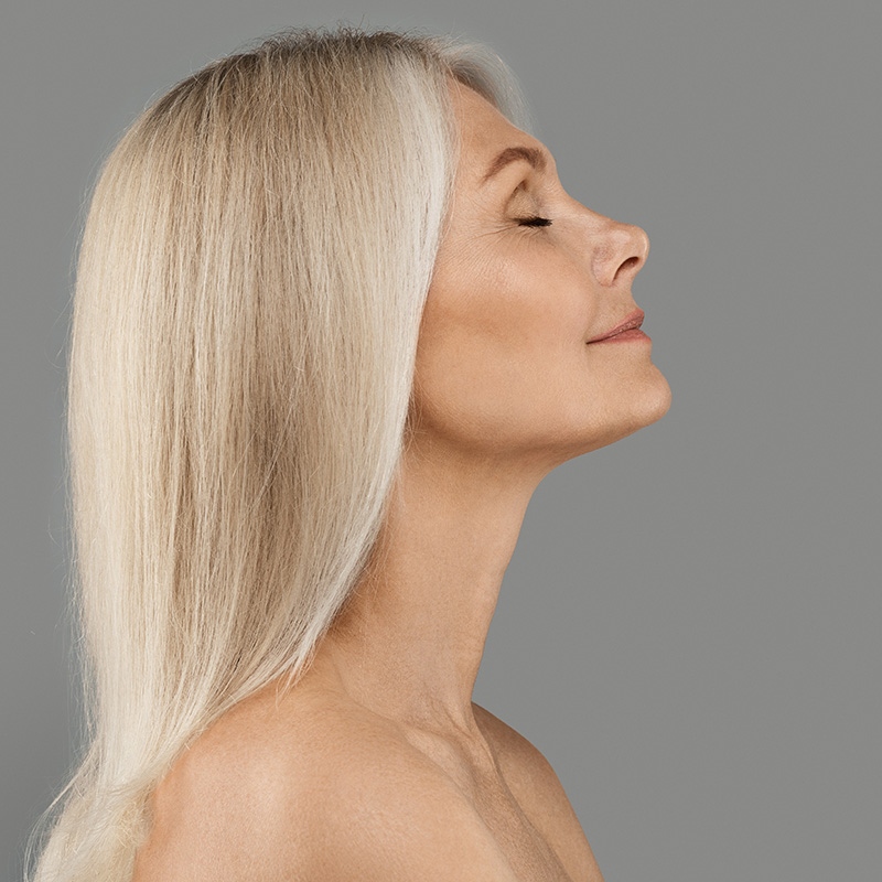 Profile of a mature woman with blonde hair